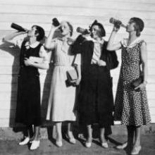 Flappers drinking from bottles